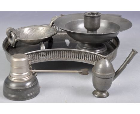 A collection antique pewter comprising a chamberstick candlestick of circular form with Heralid touch mark to base, a charmin