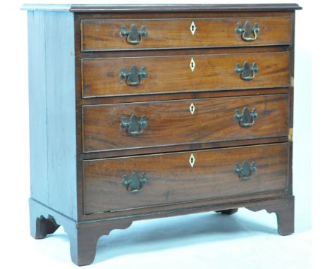 An antique 18th Century Georgian mahogany bachelor's chest of drawers of great proportions having a raised chamfered edge top