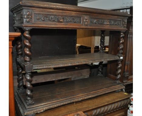 A Victorian carved oak 3-tier buffet, with lion mask carved frieze drawers, barleytwist columns, width 120cm.