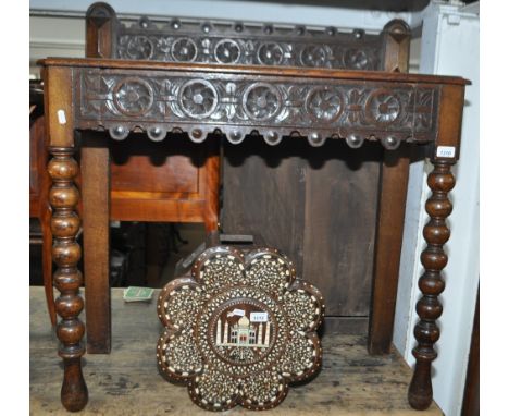 A Victorian oak console table with carved shaped raised back, frieze drawer on bobbin turned legs, width 86cm.