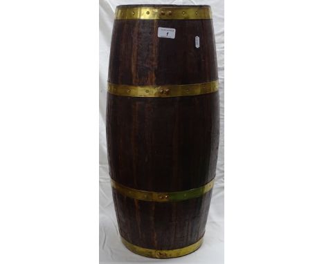 A coopered oak barrel design stick stand with brass bands.