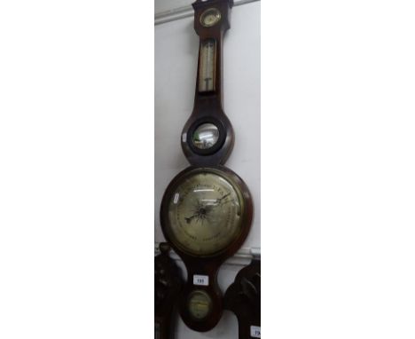 An Antique aneroid wall barometer with thermometer, inlaid stringing.