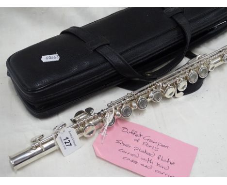 A silver plated flute with hard case and carrier by Buffet Crampon of Paris.