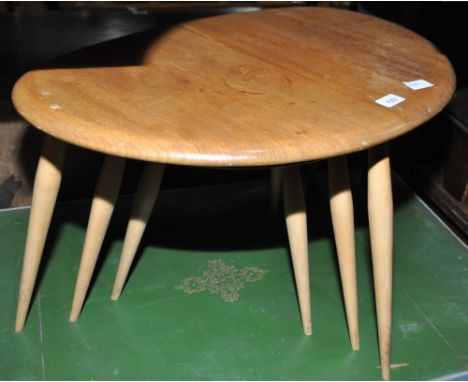 A nest of 3 Ercol light elm pebble occasional tables.