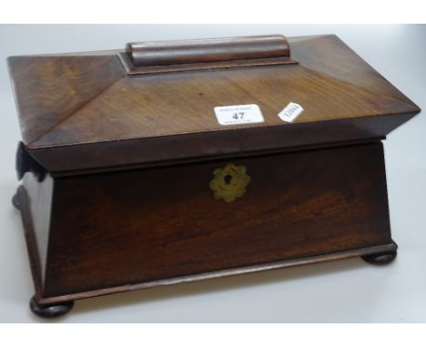 A Victorian walnut sarcophagus tea caddy.