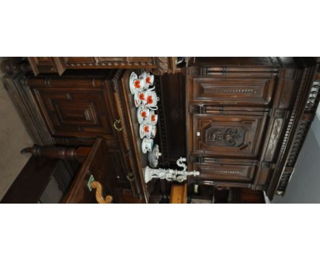 An Antique continental 3-section buffet, with fitted carved panelled cupboards and drawers, width 150cm.
