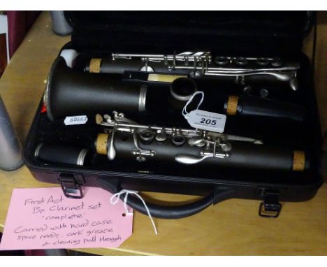 A First Act Bp clarinet set, with hard case, spare reeds, etc.