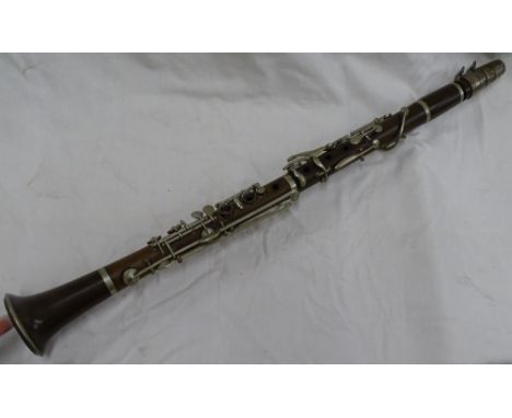 A clarinet with silver plated mounts.