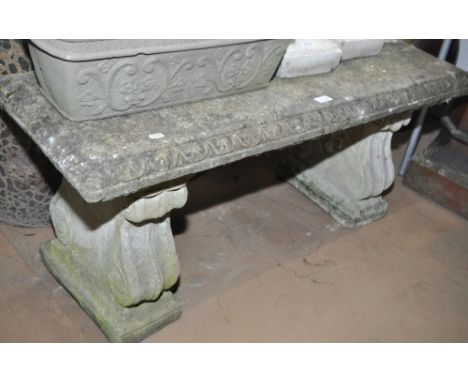 A rectangular weathered 3-section concrete garden bench, length 112cm.
