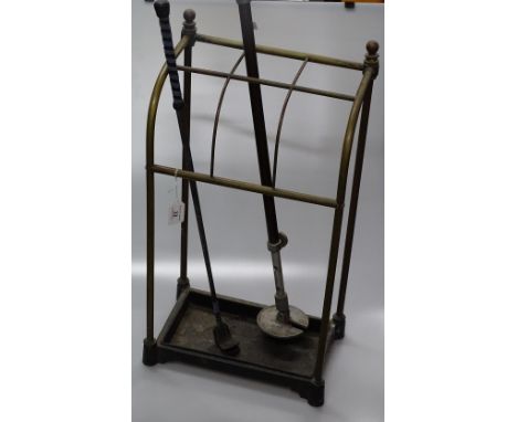 An Antique brass stick stand, with shooting stick and crop.