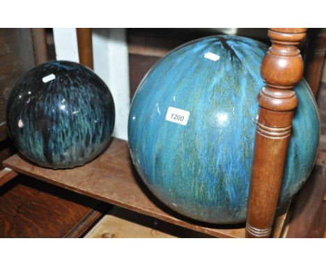 2 Glazed ceramic garden spheres, widest 30cm.