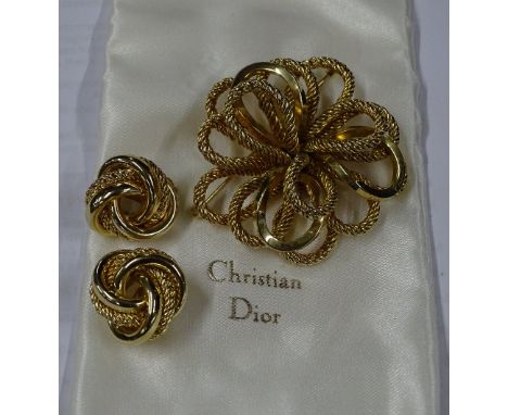Christian Dior gilt metal brooch and matching clip on earrings, original box
