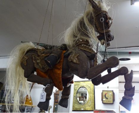 A large Eastern horse figure puppet.