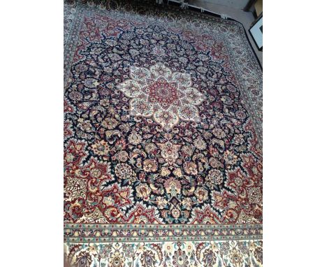 A large blue and red ground Persian Kashan design carpet, 340 x 245cm