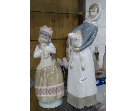 Lladro girl with lamb and another Lladro girl.