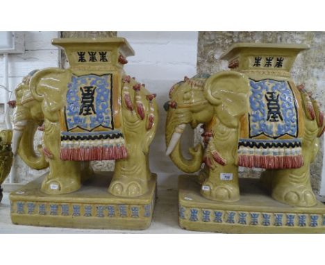 A pair of painted ceramic elephant design garden seats/stands.