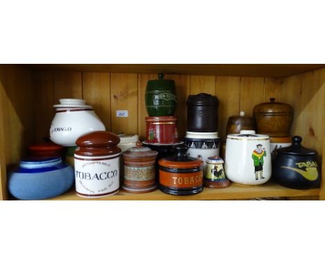 A shelf of Vintage tobacco jars.