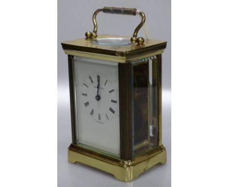 A brass cased carriage clock.