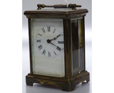 A brass carriage clock.
