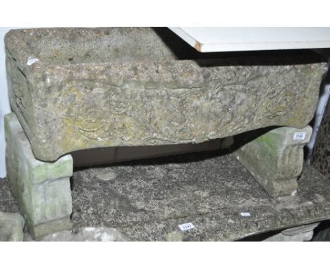 A weathered concrete garden trough on stand, length 75cm.