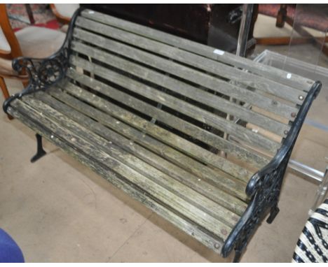 A scrolled wrought iron garden bench, width 122cm