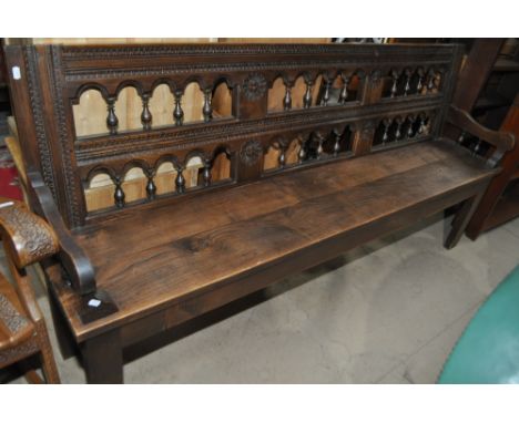 Antique oak hall bench with double spindled back, length 192cm