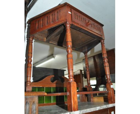 An oak canted corner console table with single drawer, width 77cm.