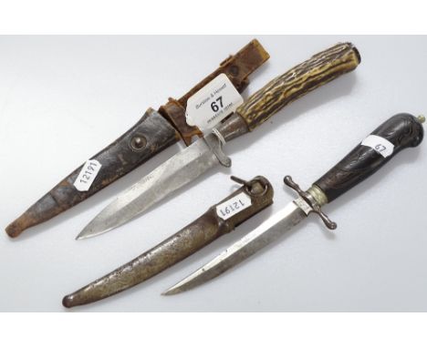 A horn handled DRGM dagger with leather sheath, and an Eskilstuna dagger and scabbard.