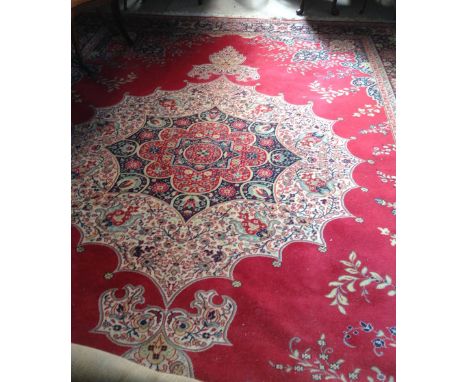 A large red ground English wool carpet, 370cm x 270cm.