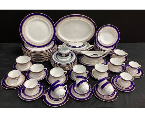 A Royal Worcester ‘Regency’, cobalt border table service for six including; six table dinner plates, six tea cups and saucers