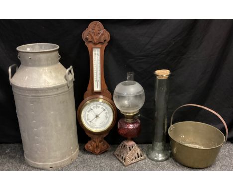 A tin milk churn ‘MILK MARKETING BOARD’,71cm high, a wooden carved barometer, jam pan, oil lamp; etc (5) 