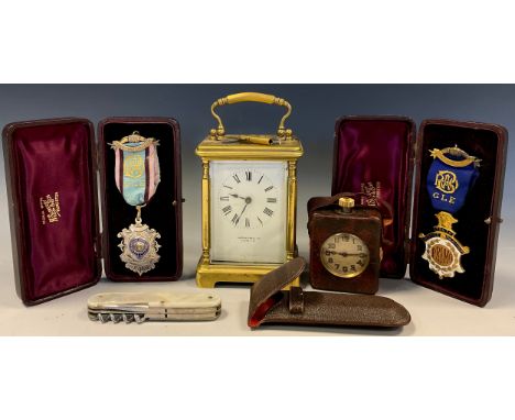 A miniature Swiss traveling clock timepiece, leather case; Mappin &amp; Webb carriage clock;   leather cased mother of pearl 