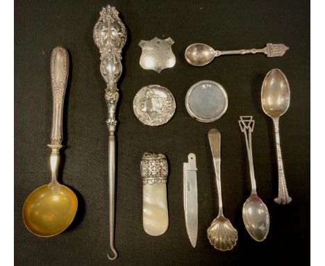 A silver mounted mother of pearl baby teething drop, Birmingham 1896, early Victorian shell bowl mustard spoon, London 1838, 