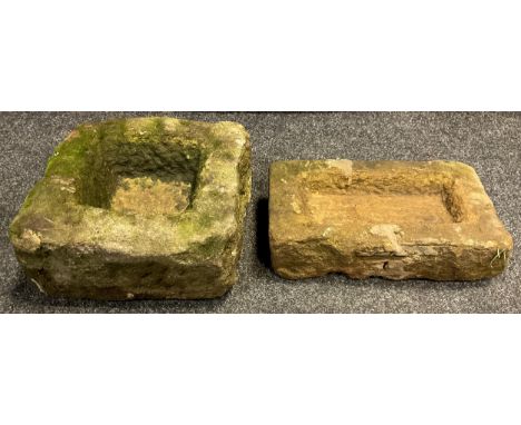 A small Derbyshire gritstone trough, 17cm high x 34cm x 31cm;  another, smaller trough, (2). 
