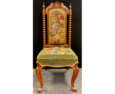 A 19th century carved walnut chair, scallop cresting, bobbin turned spindles, cabriole legs, tapestry upholstered back and se
