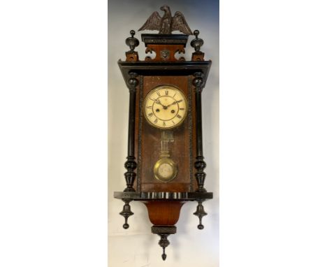 A Junghans mahogany cased musical Vienna clock, eagle cresting, turned and ebonised finials, white dial with black Roman nume