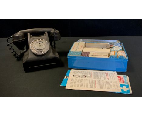 A Johnson &amp; Johnson Dixcel first aid kit, with all original contents;  a vintage black Bakelite dial telephone, 332L (2) 