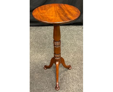 A 19th century Mahogany lamp table, circular top, turned column, tripod feet, 70cm high, 33cm diameter 