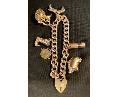 A 9ct gold charm bracelet, padlock clasp, suspending six charms, Pig, Miners Lamp, pair of Cowboy Boots etc 46.4g gross 