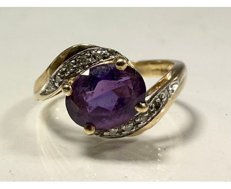 An amethyst and cz dress ring, twisting crest, 9ct gold shank, size K, 2.3g gross 