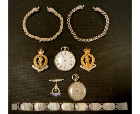 Jewellery &amp; Watches - two silver coloured metal mask head torc bangles, dragon mask terminals, rope twist chain bodies, u
