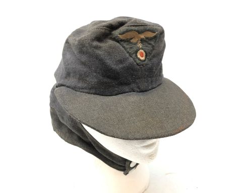 WW2 German Luftwaffe M-43 field cap, blue wool with one piece eagle and cockade insignia, two button front, cloth lined inter