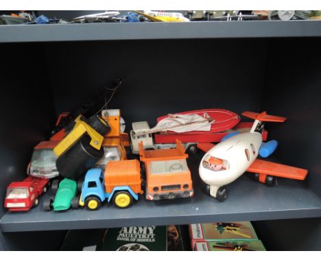 A shelf of mixed toys inc Tonka, Starr yacht, Fisher price etc 