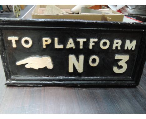 A vintage wooden railway sign, 'To platform No 3' white lettering on black background