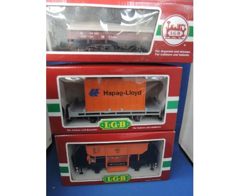 Three LGB G scale items of rolling stock, OEG hopper wagon 4141, Hapag-Lloyd container wagon 42030, DR covered wagon 41230 al