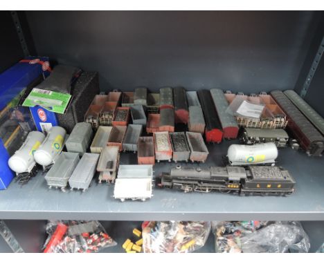 A shelf of 00 gauge inc Heljan & Hornby rolling stock, a Lima 2-6-0 loco and tender, kit built rolling stock etc