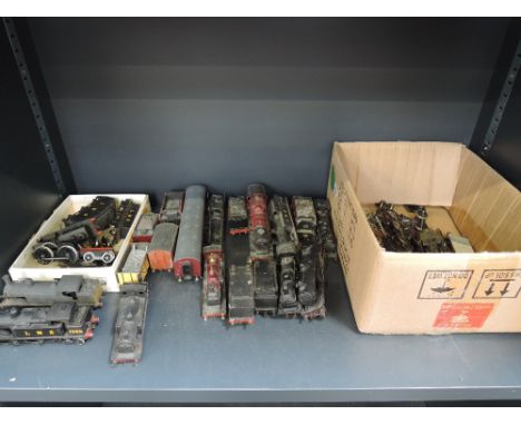 A shelf of 00 gauge kit built tank engines, loco and tender and rolling stock 