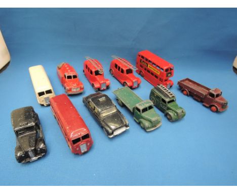 Eleven Dinky die-casts including Austin Taxi, Humber Hawk police car, fire engine with bell 250 etc