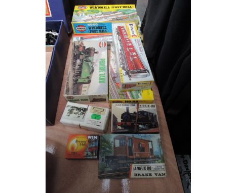 A selection of mixed scale plastic and metal kits inc Airfix, Rosebud, and Tramalan, train and tram interest