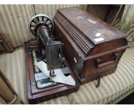A vintage hand crank sewing machine, Singer B424201